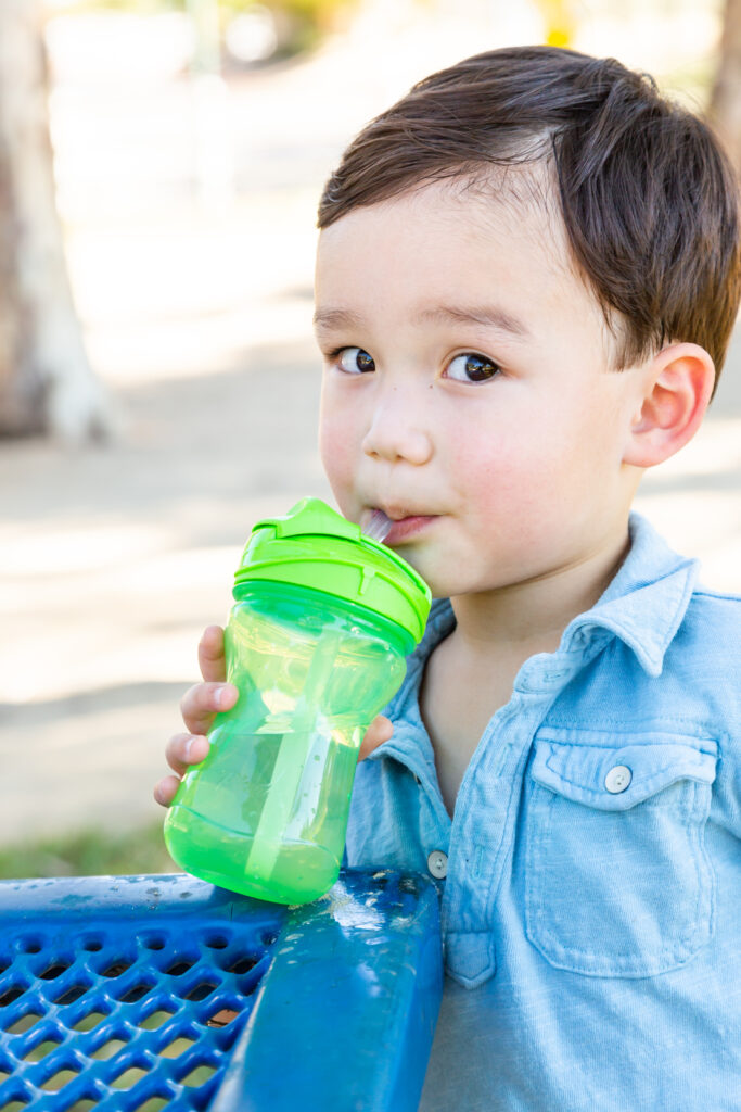 A child drinking from a cup