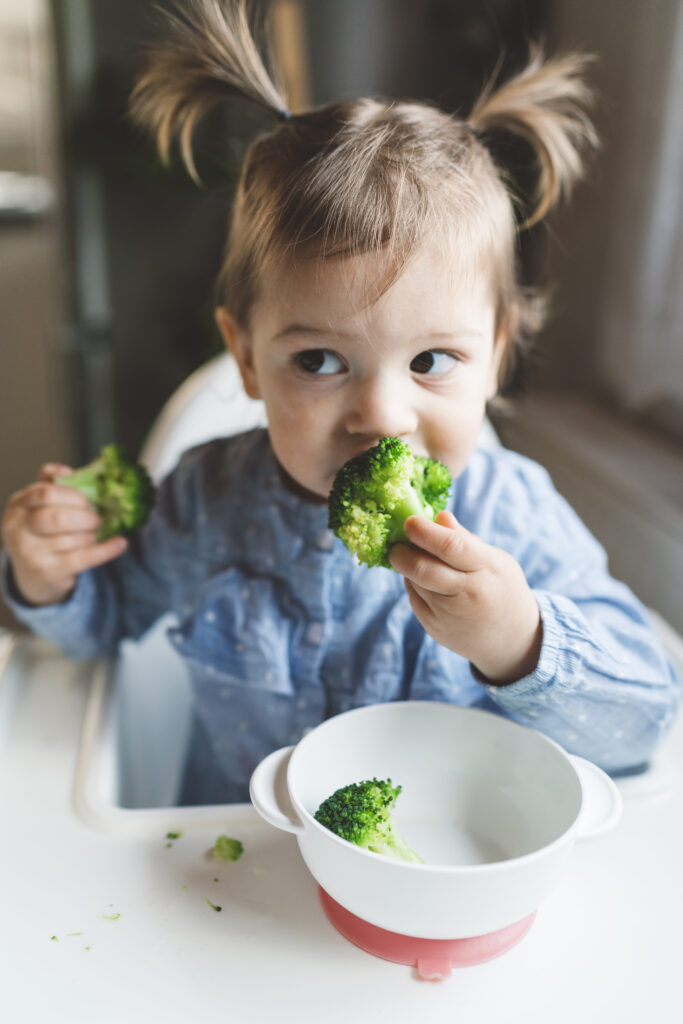 A baby trying solid food